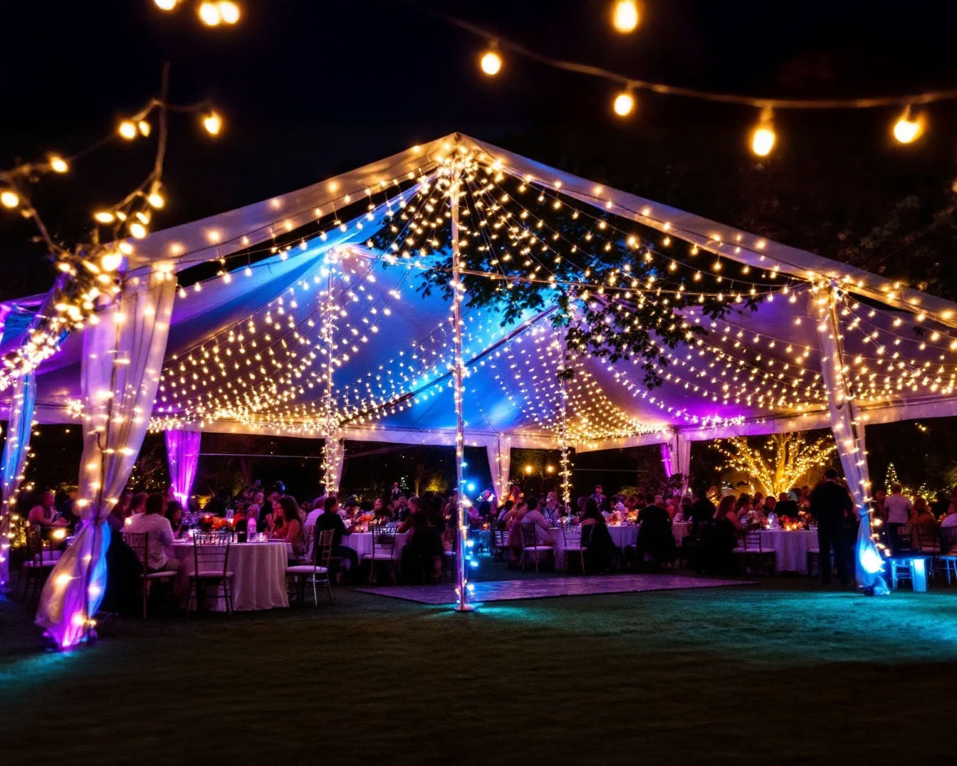 Outdoor holiday event in San Antonio featuring a canopy tent adorned with light strings, creating a festive atmosphere.