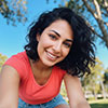 Portrait of Maritza Ramirez smiling outdoors in natural lighting